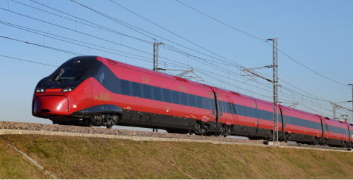 An Italo high-speed train traveling on an elevated track.