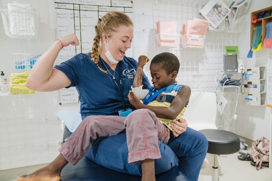 Child Patient with Nurse Aboard Mercy Ships