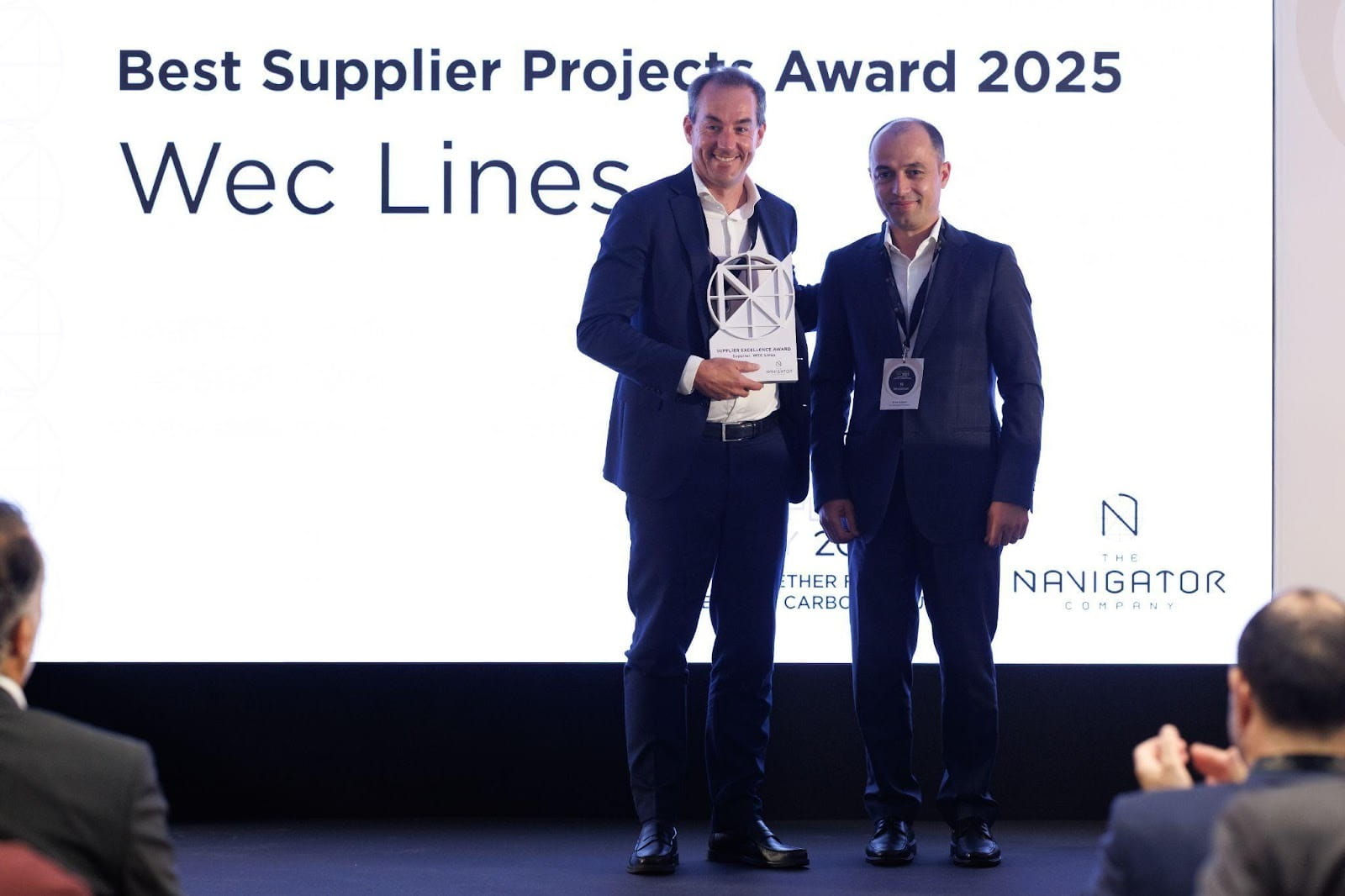 WEC Lines representative accepting the 2025 Supplier Excellence Award at The Navigator Company Supplier’s Day in Portugal.